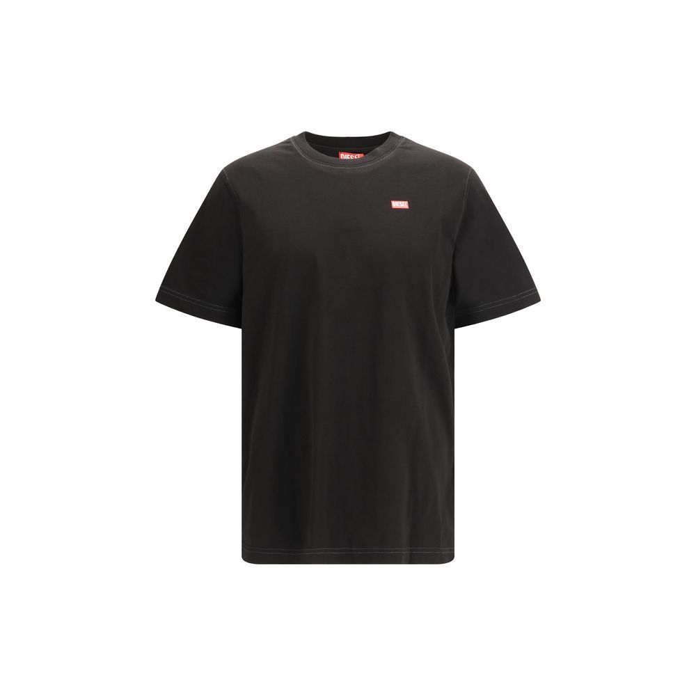 T-shirt en coton noir Diesel, coupe classique, avec logo Diesel sur la poitrine, porté sur un mannequin.