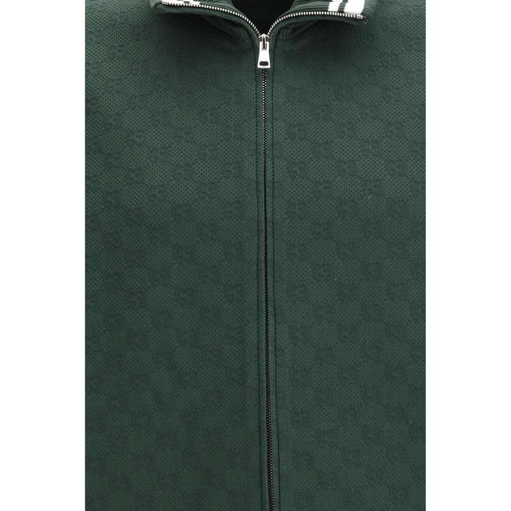 Veste bicolore en polyamide de Gucci, coupe-vent avec fermeture éclair, détails modernes et logo Gucci visible sur la poitrine.