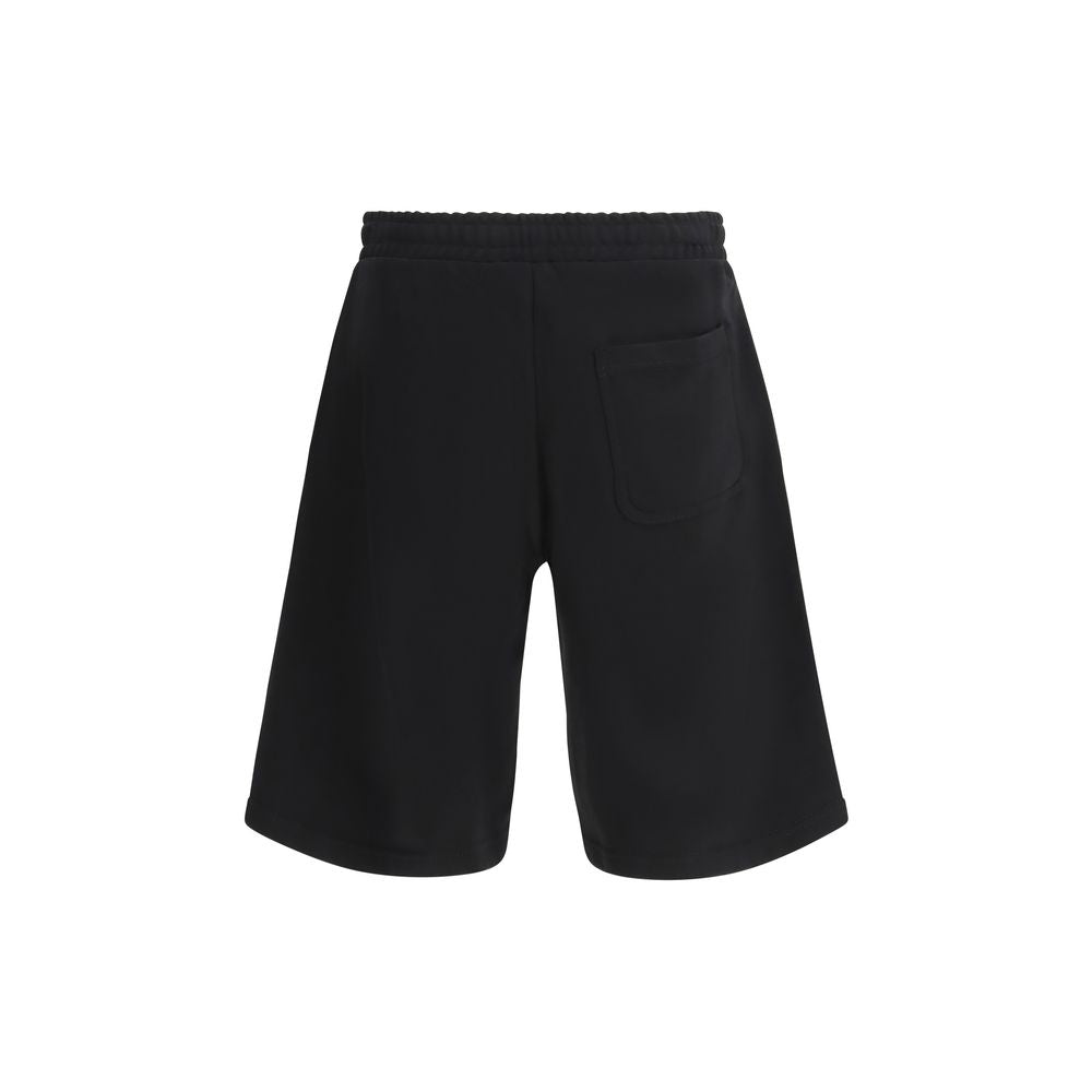 Shorts Bermuda en coton noir de la marque Diesel, visibles avec détails de couture et style décontracté.