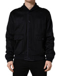 Veste en cachemire noir Dolce & Gabbana à boutons, tricotée, avec col et poches visibles, élégante et sophistiquée.