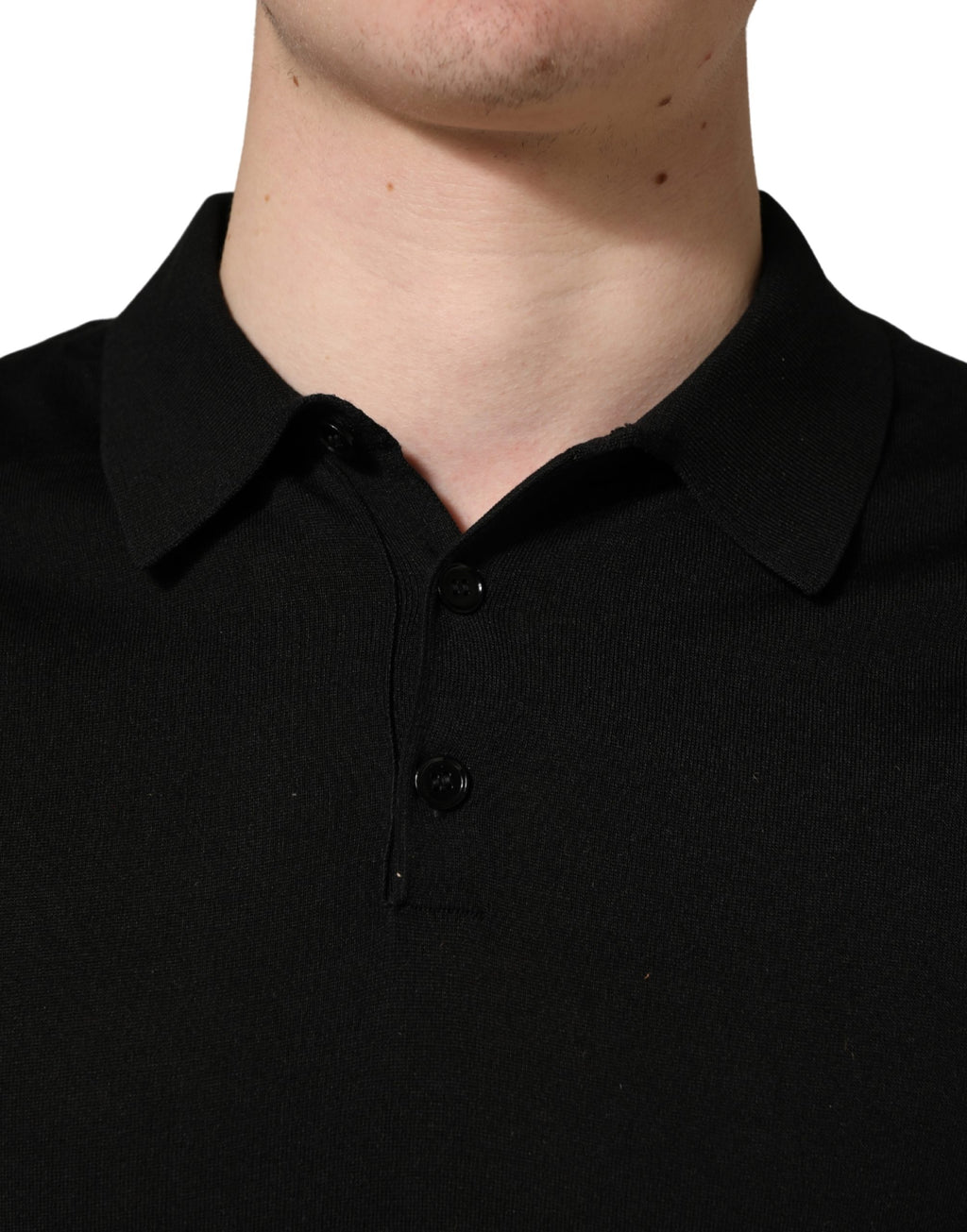 Polo pour homme Dolce & Gabbana en laine noire à manches courtes, style élégant et classique.