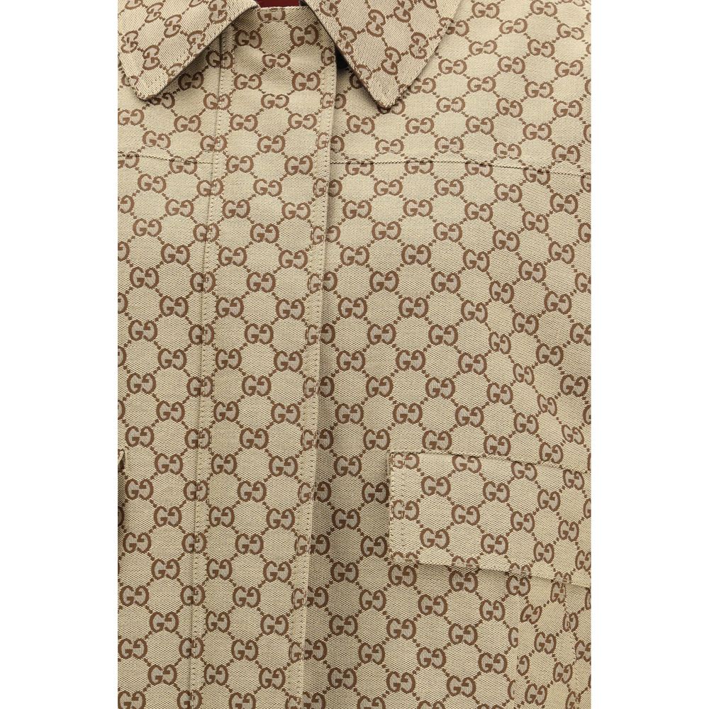 Veste bomber en coton beige de Gucci, style décontracté avec logo Gucci sur le devant, vue de face.