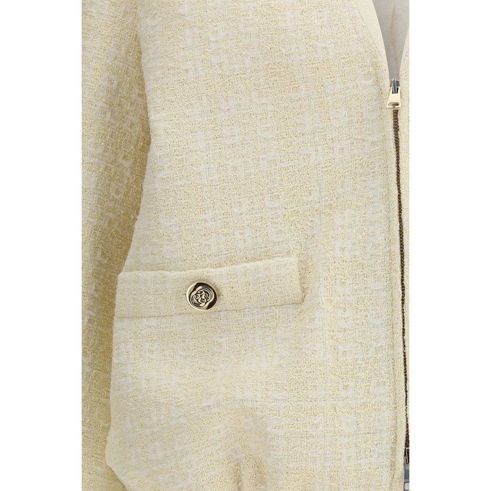 Veste bomber en coton beige de Gucci, style élégant avec détails de marque, vue de face sur fond neutre.