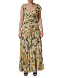 Robe longue plissée en soie jaune avec imprimé floral Dolce & Gabbana, silhouette élégante et délicate.