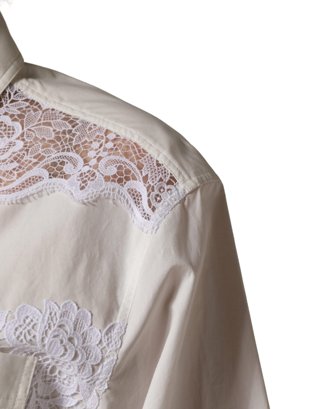 Combinaison longue en coton blanc avec dentelle Dolce & Gabbana, manches longues élégantes et détails raffinés.