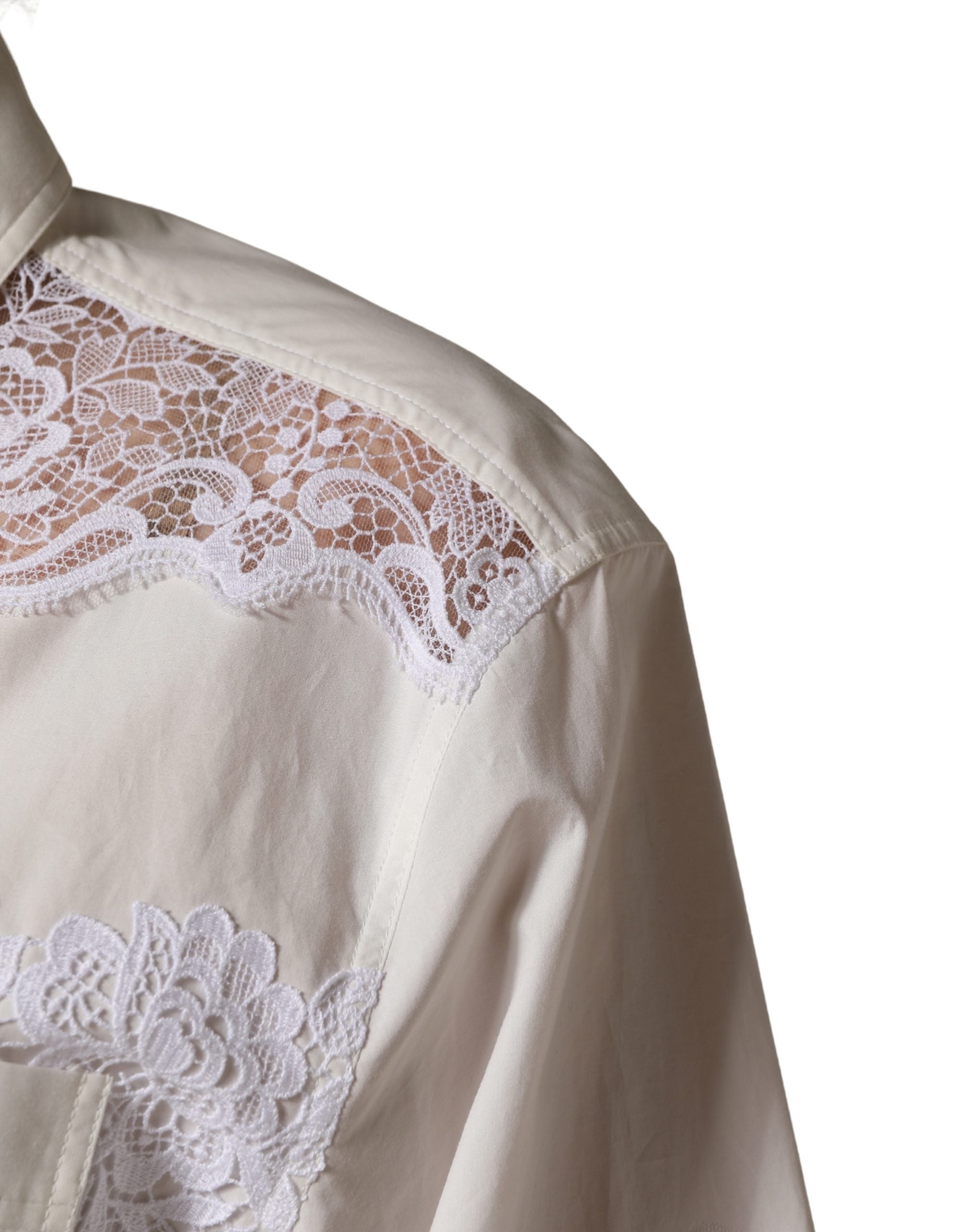 Combinaison longue en coton blanc avec dentelle Dolce & Gabbana, manches longues élégantes et détails raffinés.