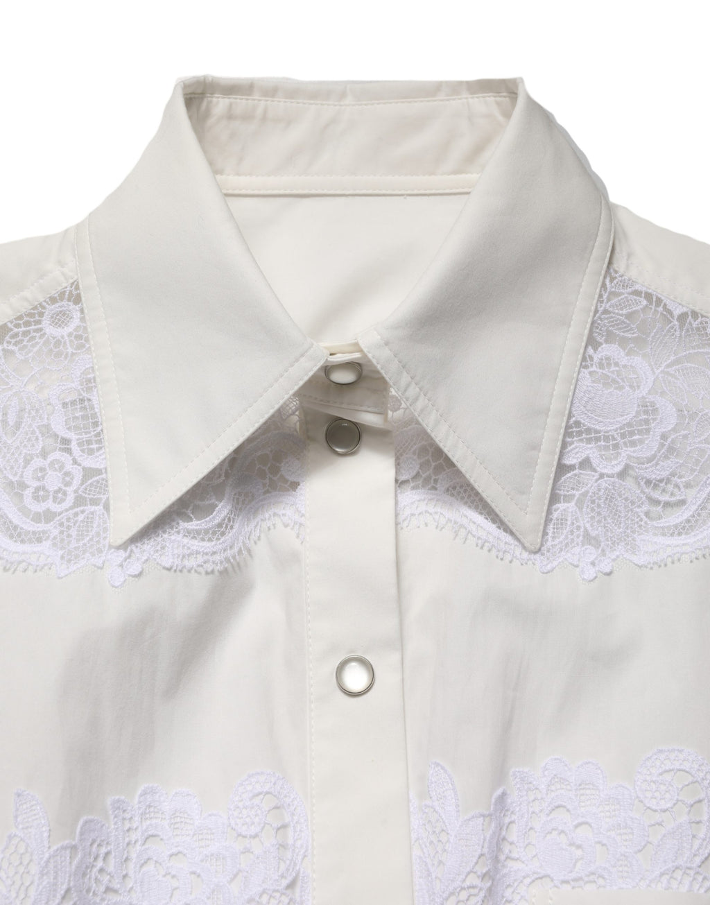 Combinaison longue en coton blanc avec dentelle, manches longues et détails élégants, signée Dolce & Gabbana.