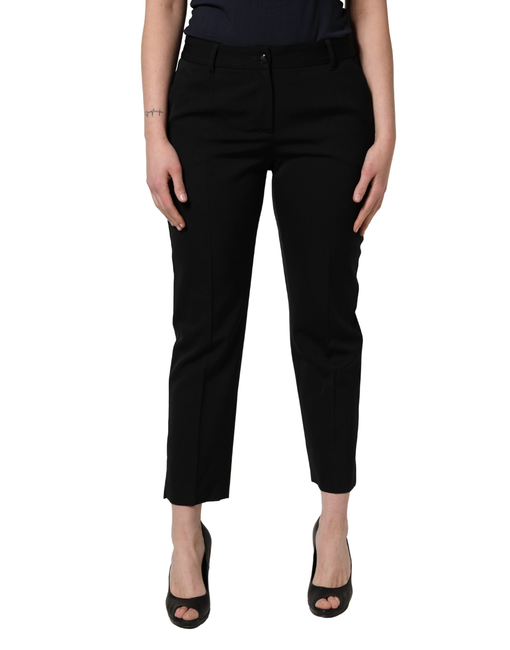 Pantalons cropped en laine noire Dolce & Gabbana à taille haute et coupe tapered, vue de face.