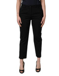 Pantalon cropped tapered en laine noire Dolce & Gabbana à taille haute, visible détails du tissu et coupe élégante.
