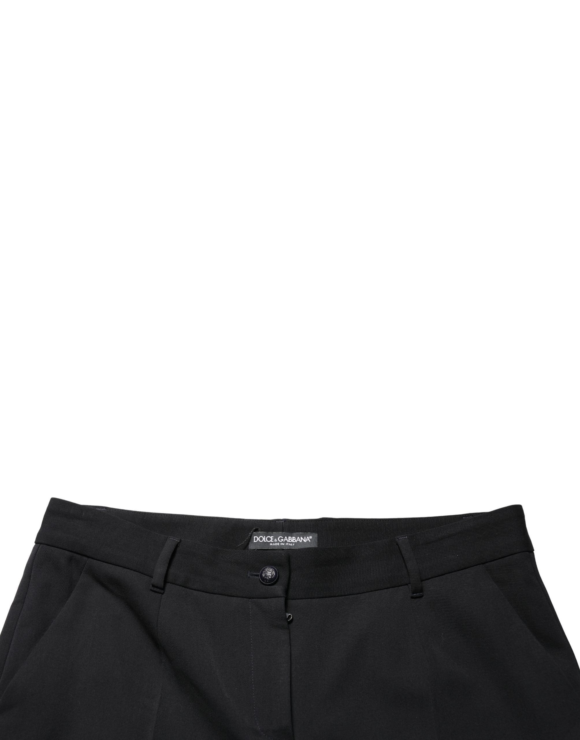 Pantalon noir en laine Dolce & Gabbana, taille haute, cropped et tapered, vue de face sur fond blanc.
