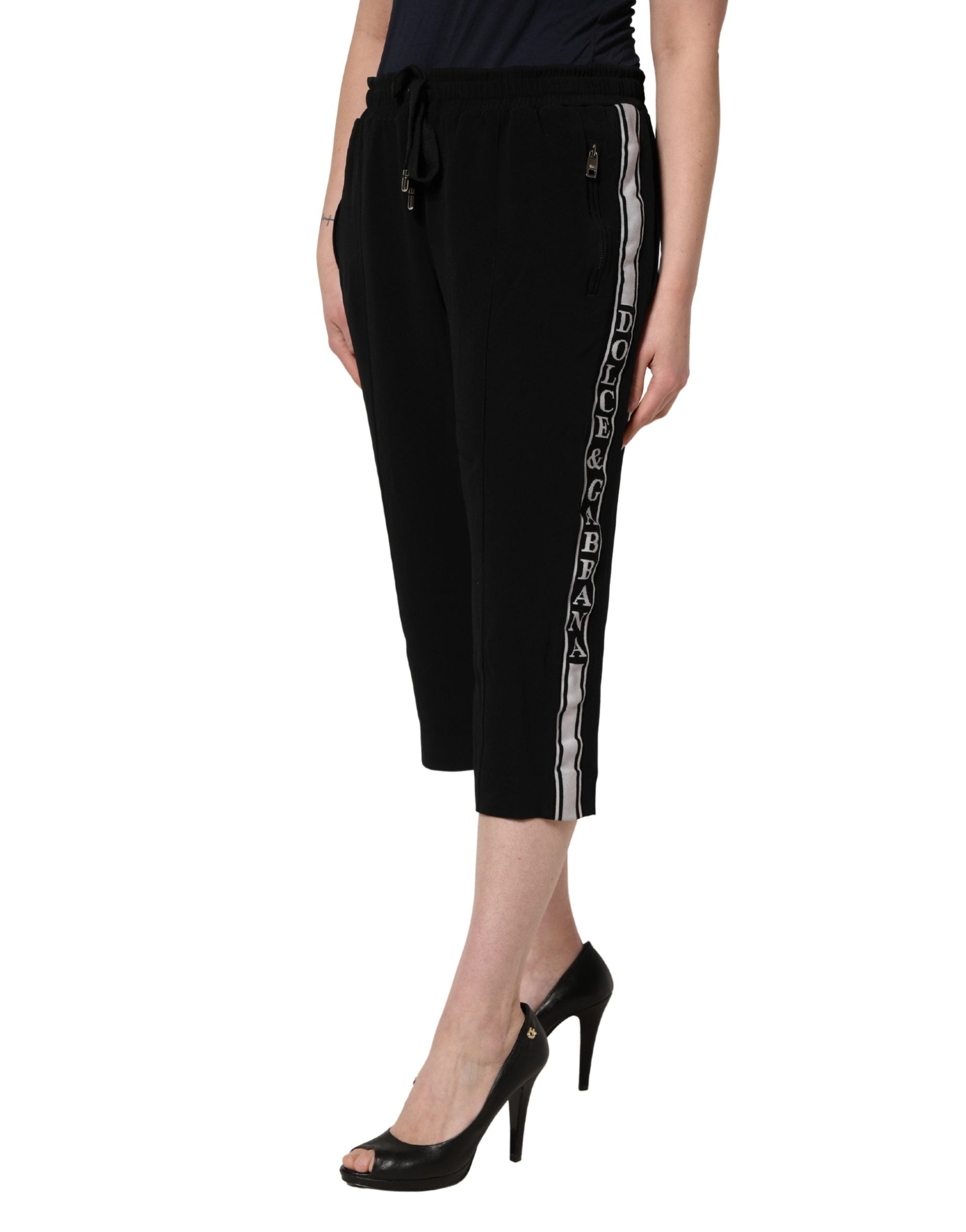 Pantalon femme noir Dolce & Gabbana en viscose, taille mi-haute et coupe cropped, élégance moderne et confort sophistiqué