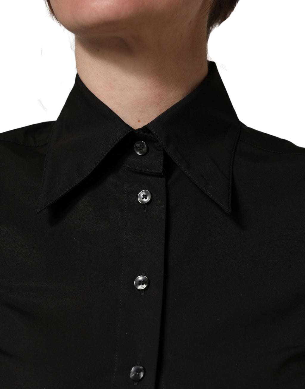 Chemisier sans manches noir en coton de Dolce & Gabbana avec col à revers, élégant et classique.