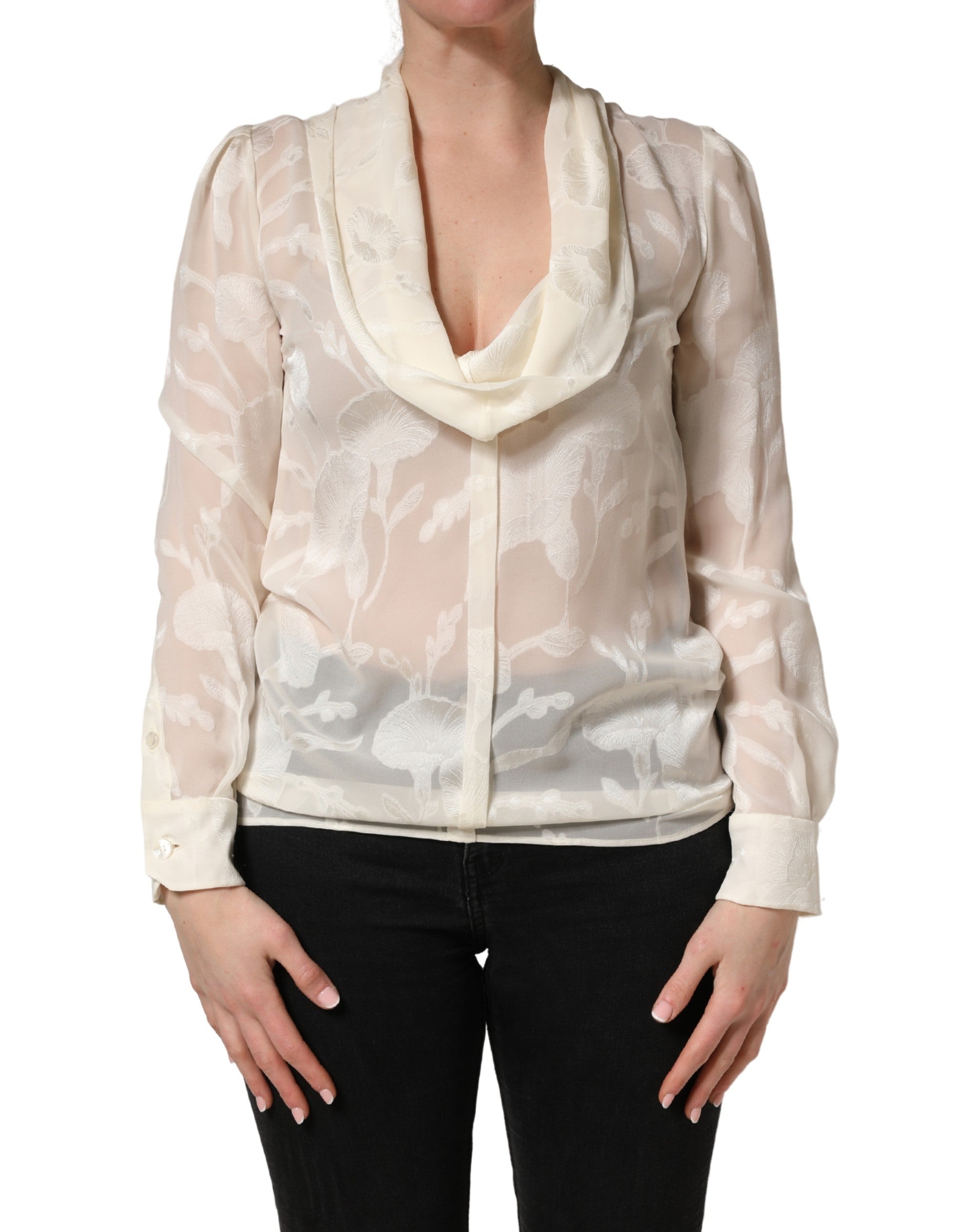 Blouse en soie semi-transparente à motifs floraux blancs et beiges de Dolce & Gabbana, élégante et légère.