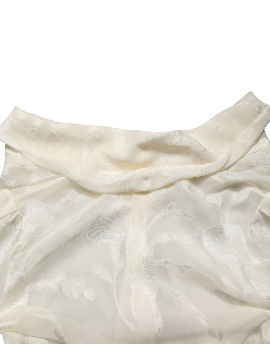 Chemisier en soie semi-transparente à fleurs blanc cassé de Dolce & Gabbana, détail floral élégant et finition légère.