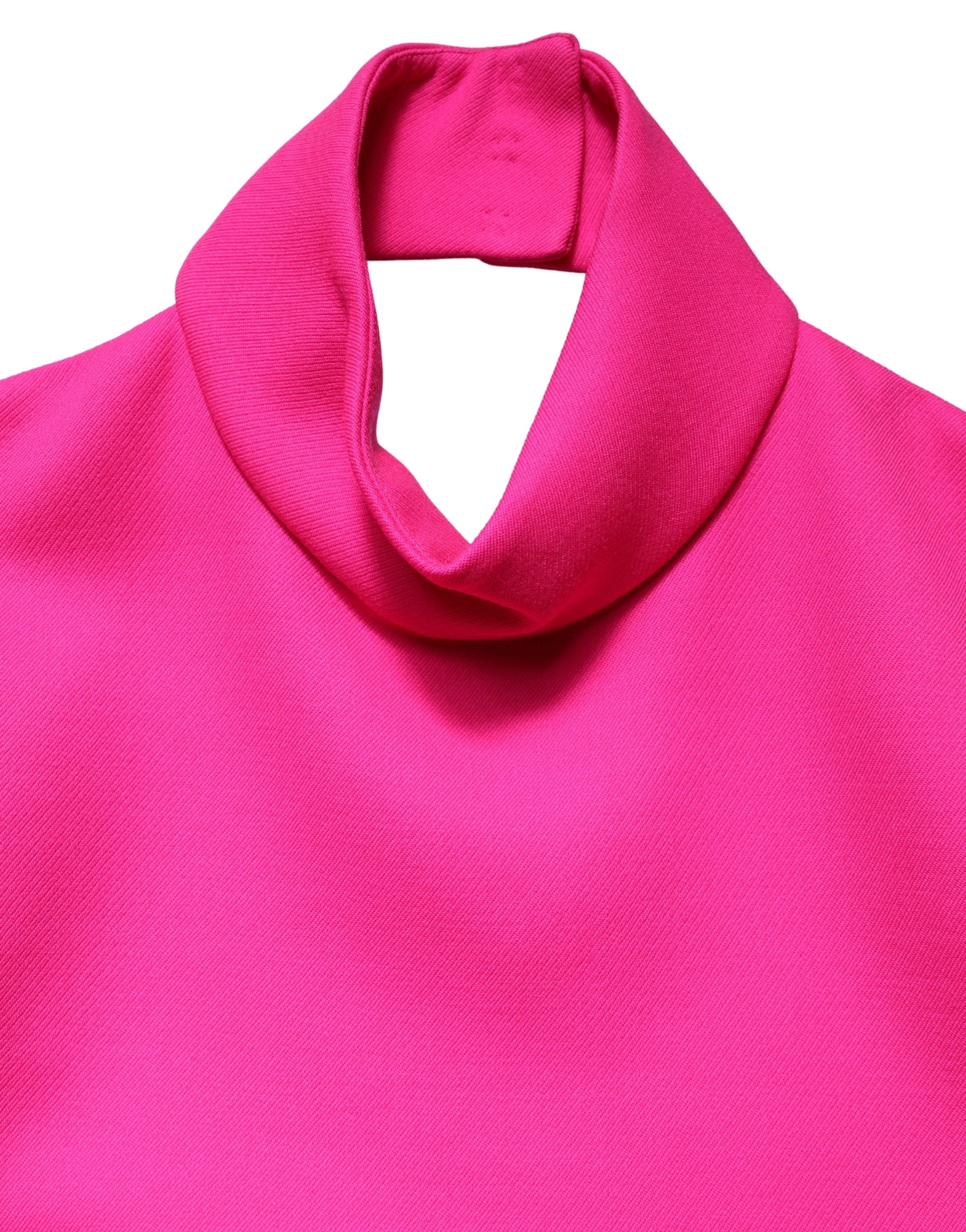 Débardeur sans manches en laine rose vif de Dolce & Gabbana, dos nu, style élégant et moderne.