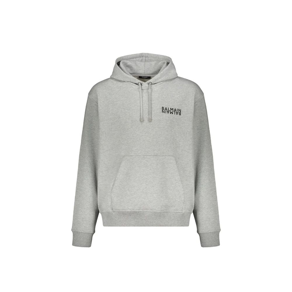 Sweat à capuche gris en coton de la marque Balmain, avec logo discret visible sur le devant.