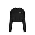 Sweatshirt en coton noir de Balmain, style décontracté avec logo discret, porté sur un mannequin.