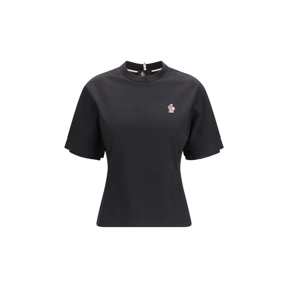 T-shirt en coton noir Moncler Grenoble, style décontracté avec logo discret, porté sur mannequin.