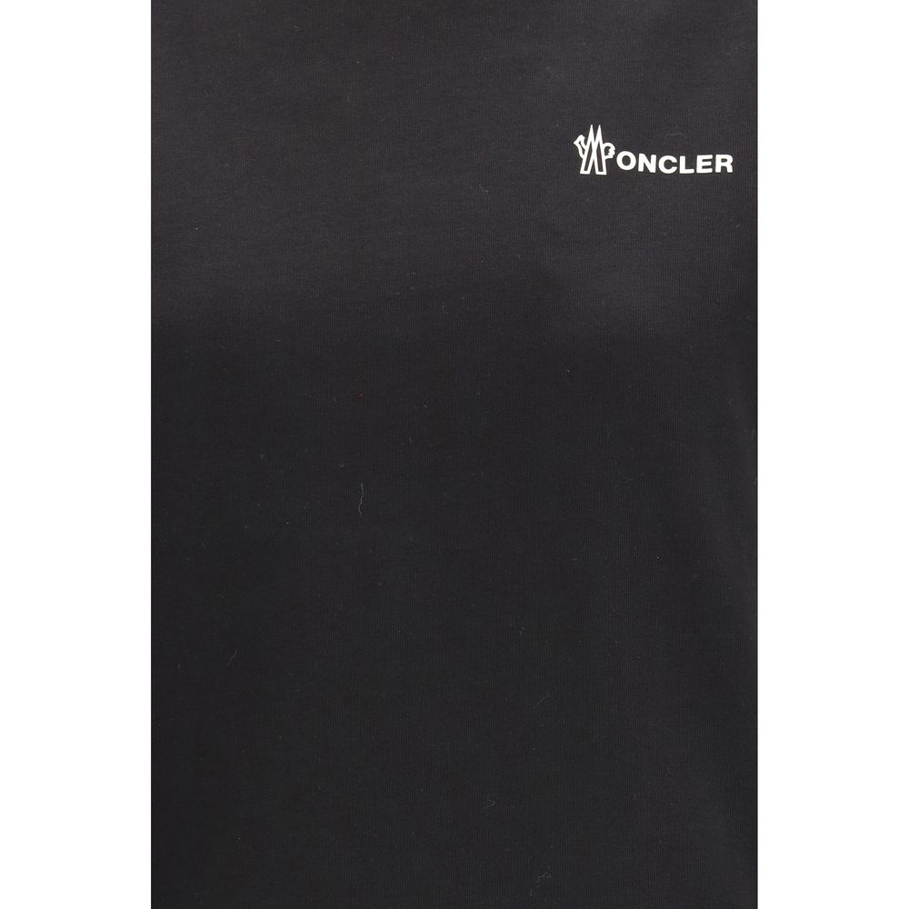 Vêtements de sport en coton noir Moncler Grenoble, style décontracté et confortable pour activités sportives.