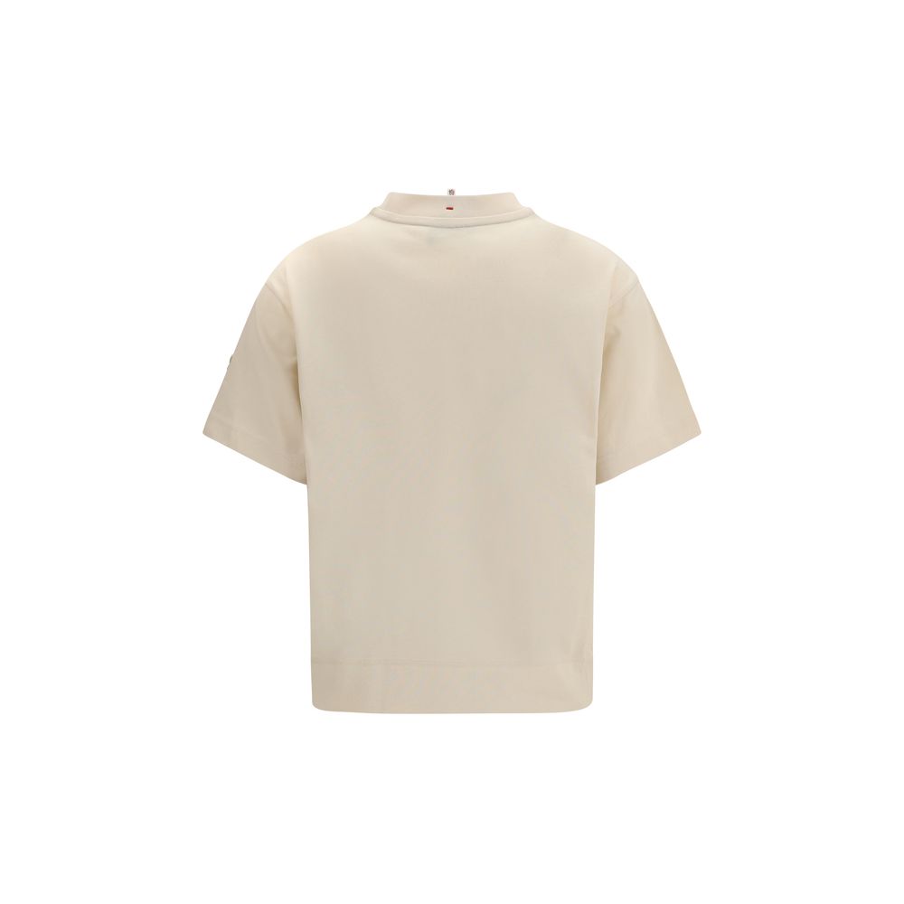 Veste de sport beige Moncler Grenoble en coton, adaptée pour activités sportives et casual, avec détails de design visibles.