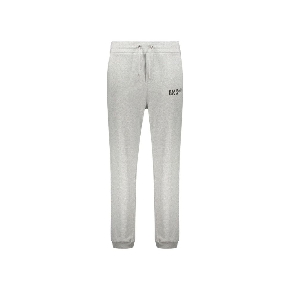 Pantalons de jogging gris Balmain en coton pour entraînement, style décontracté et confortable, visibles en gros plan.