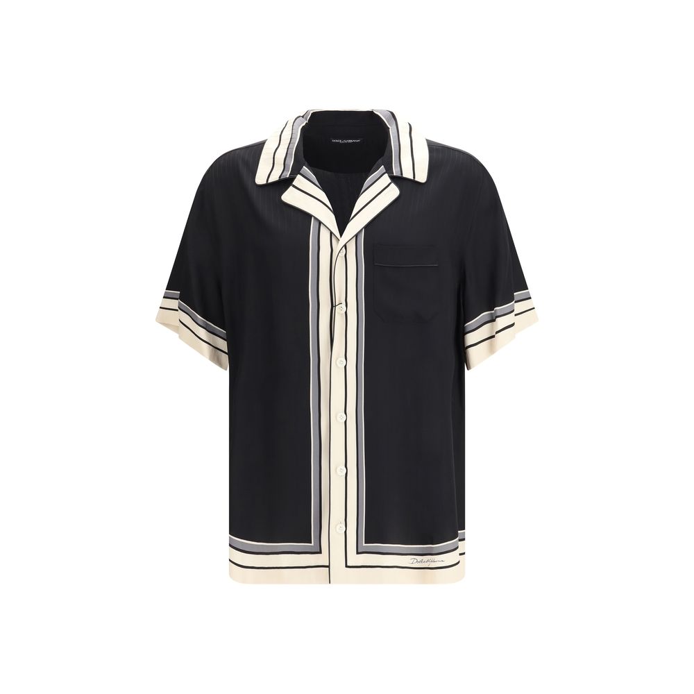 Chemise Dolce & Gabbana à manches courtes en soie multicolore, détails élégants et tissu léger visible sur l'image.