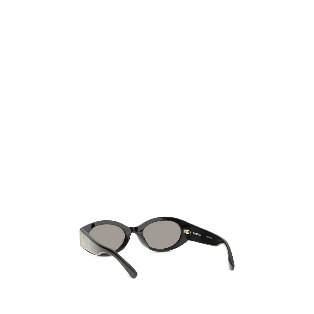 Lunettes de soleil Balenciaga noires en acétate avec monture épaisse et design moderne, vues de face.
