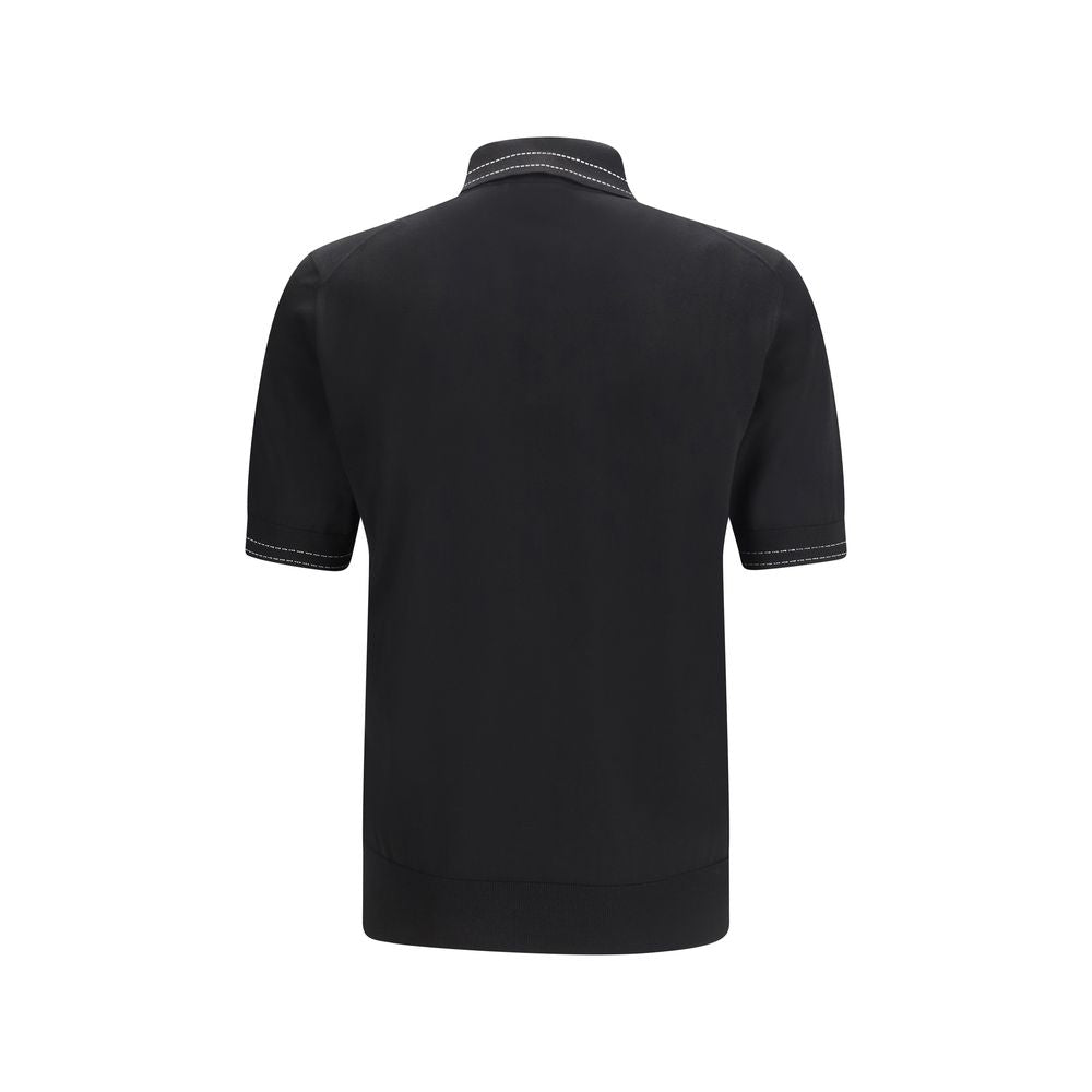 Chemise polo en soie noire Dolce & Gabbana, détail élégant avec col et boutons, image montrant le tissu et la coupe.