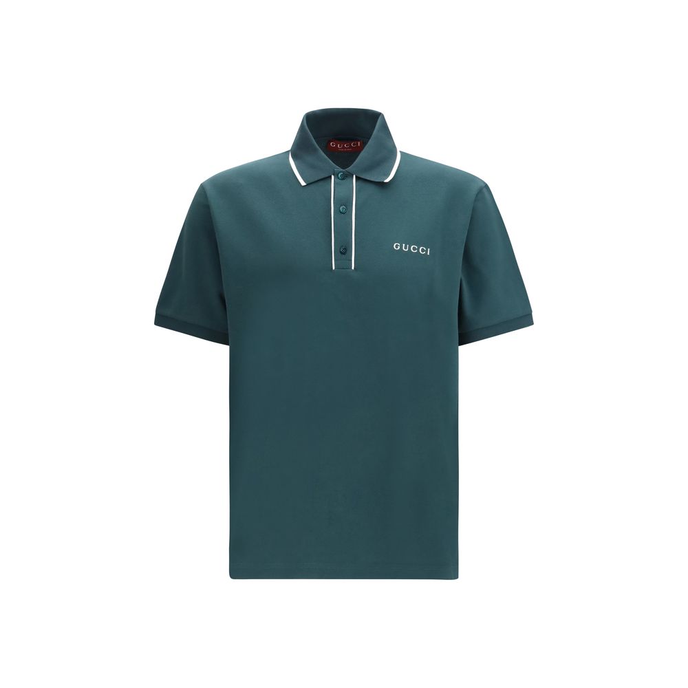 Chemise polo en coton bicolore Gucci avec col et manches contrastés, logo Gucci visible sur la poitrine.