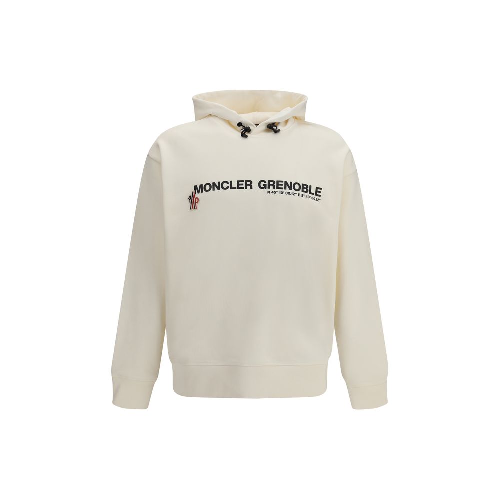 Sweat-shirt beige en coton de Moncler Grenoble, coupe décontractée, porté avec col rond et manches longues.