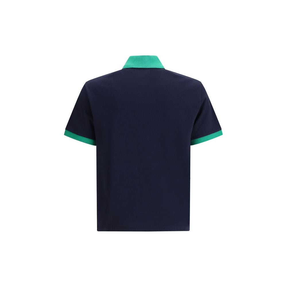 Chemise polo en coton bleu de la marque Versace, vue de face avec logo visible sur la poitrine.