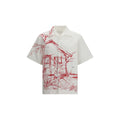 Chemise blanche en coton de Prada, vue de face, avec col classique et logo discret, pour un style élégant et sophistiqué.