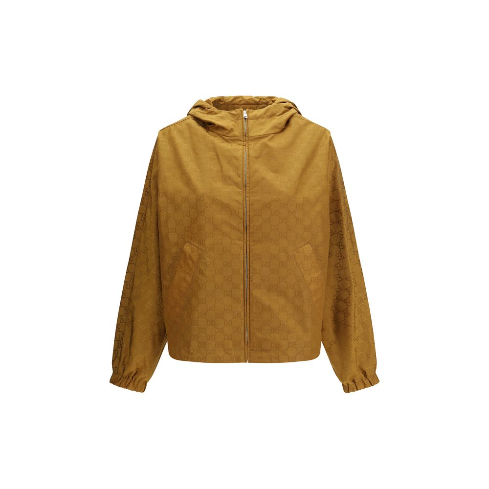Veste en nylon beige Gucci, coupe classique avec logo Gucci visible, idéale pour un style décontracté et élégant.