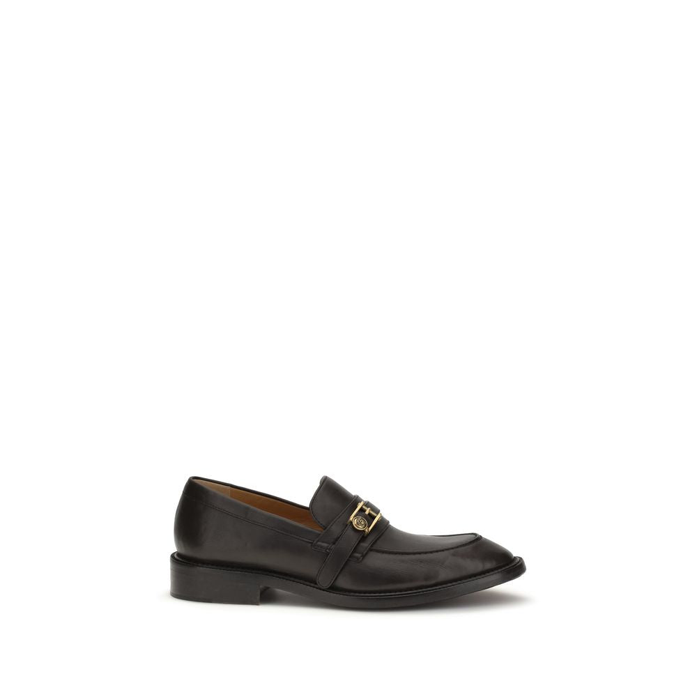 Chaussures mocassins Versace Bos Taurus en cuir de veau noir, slip-on élégants et sophistiqués pour homme.