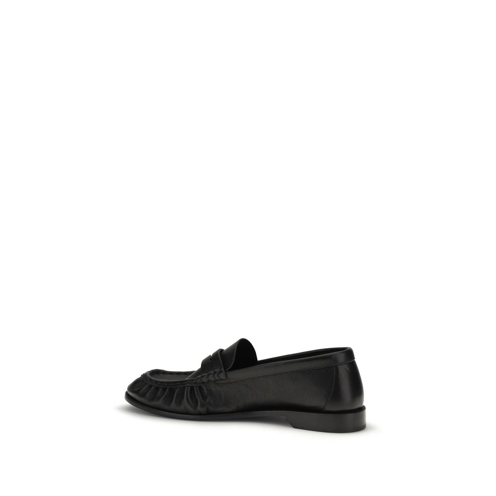 Chaussures mocassins Saint Laurent Bos Taurus en cuir de veau noir, slip-on élégants pour homme.