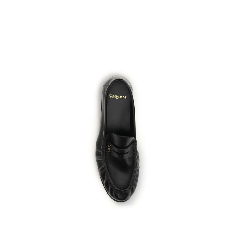 Chaussures mocassins Saint Laurent Bos Taurus en cuir de veau noir, slip-on élégants et sophistiqués.