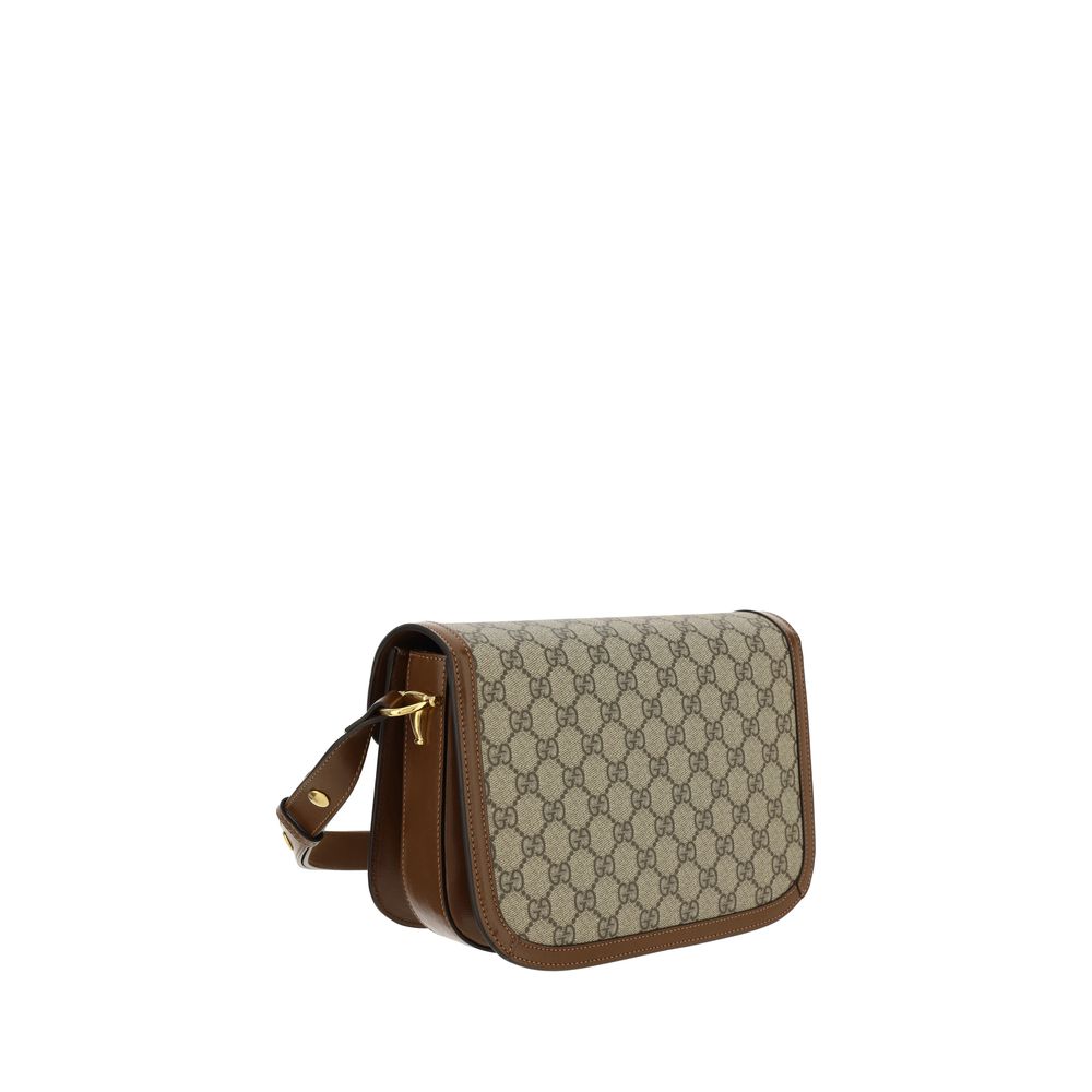 Sac à main en coton beige de Gucci, avec détails élégants, pour un look chic et sophistiqué.