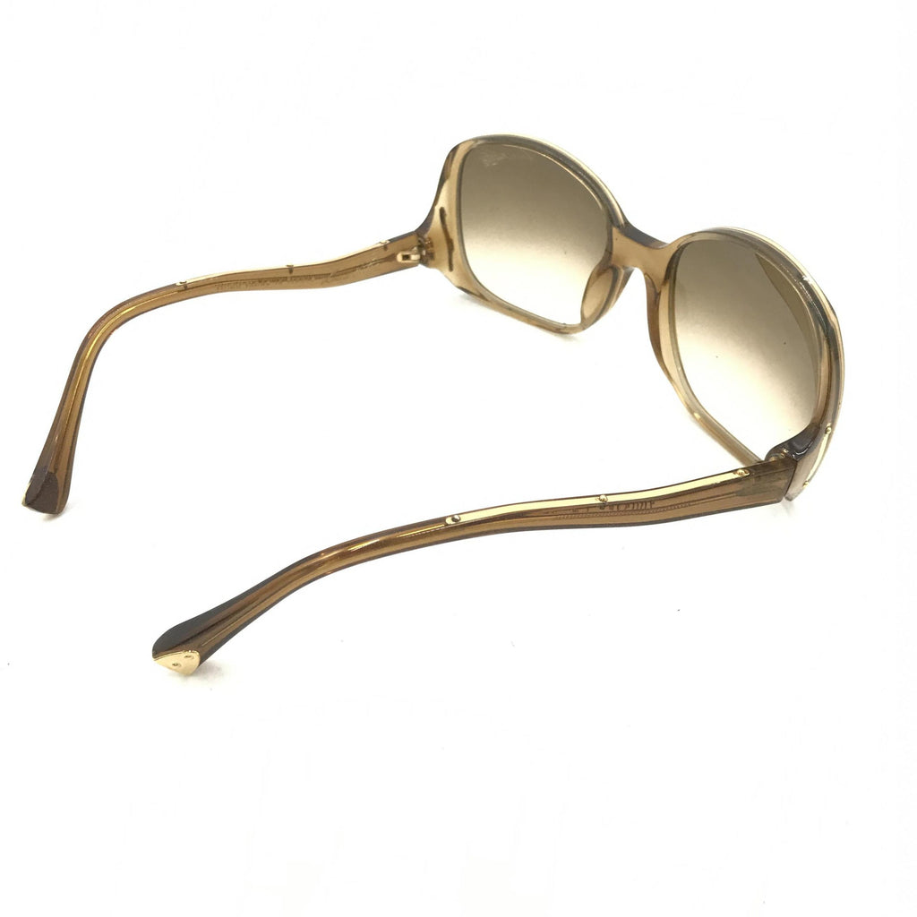 Lunettes de soleil Louis Vuitton à monture en acétate marron à motifs tachetés, style élégant et sophistiqué.