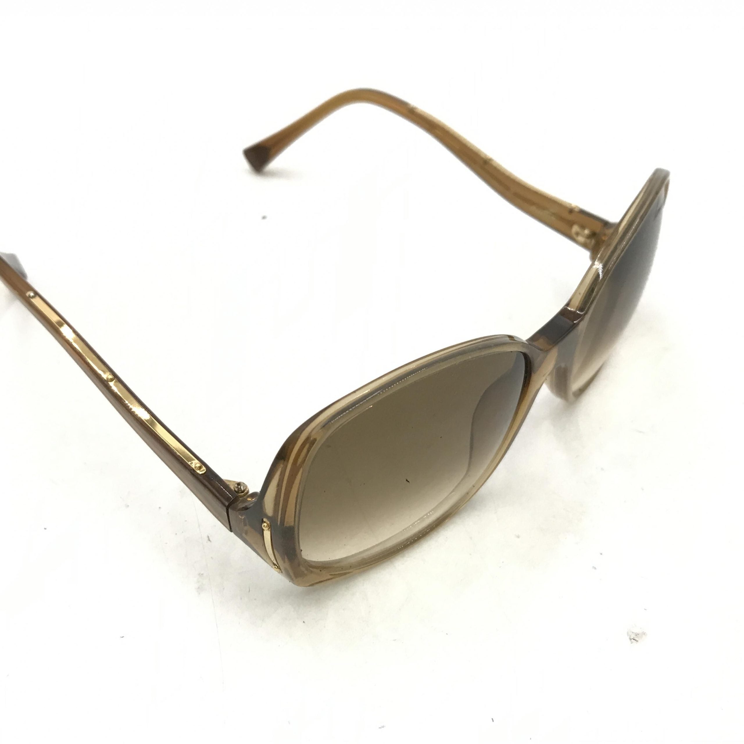 Lunettes de soleil Louis Vuitton en acétate brun à éclats, monture élégante et moderne, pour un style sophistiqué.
