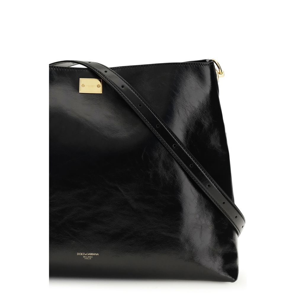 Sac à bandoulière en cuir de veau noir Bos Taurus de Dolce & Gabbana, avec détails élégants et finition de qualité.