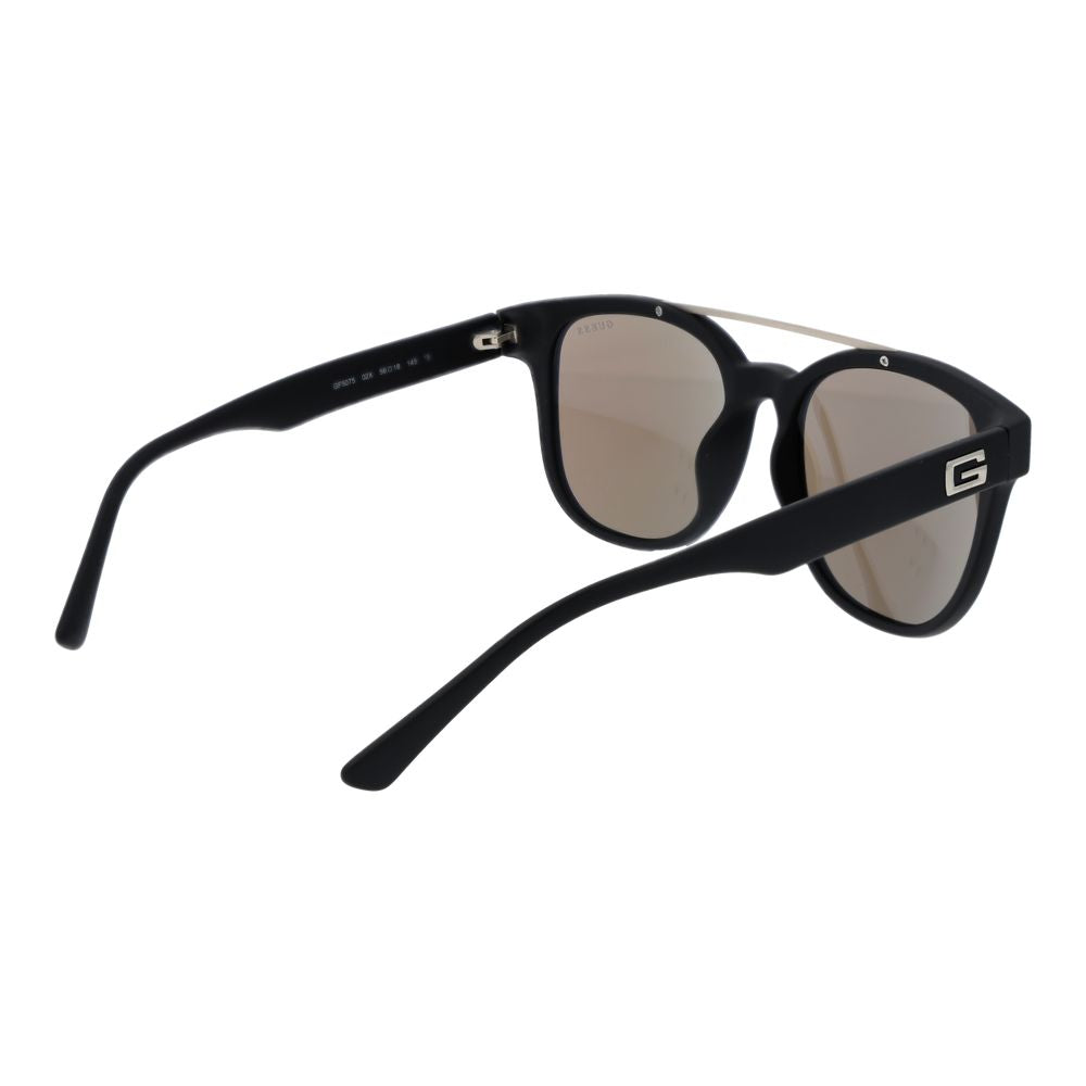 Lunettes de soleil noires en plastique Guess avec monture tendance et lentilles foncées, parfaites pour un style élégant.