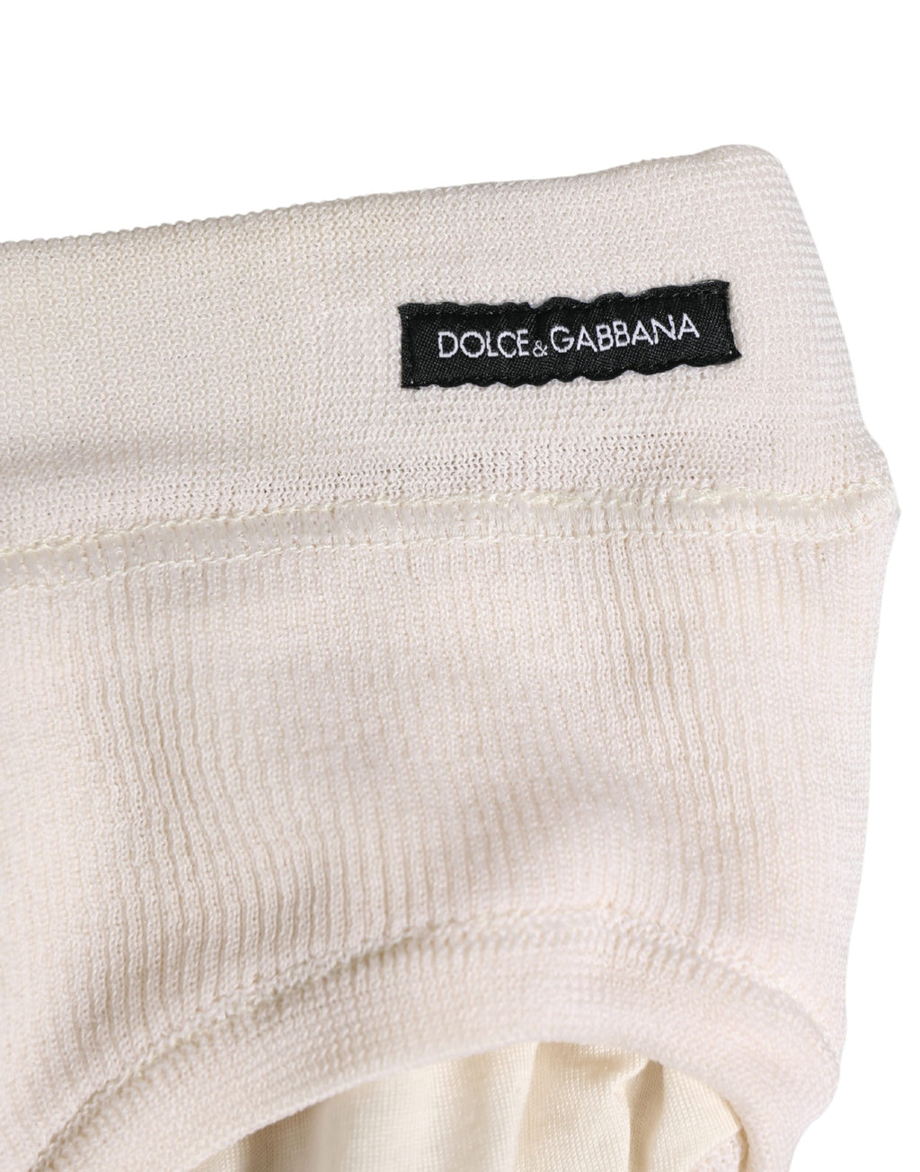 Sous-vêtements homme Dolce & Gabbana en soie blanche avec logo, slips briefs élégants et confortables.
