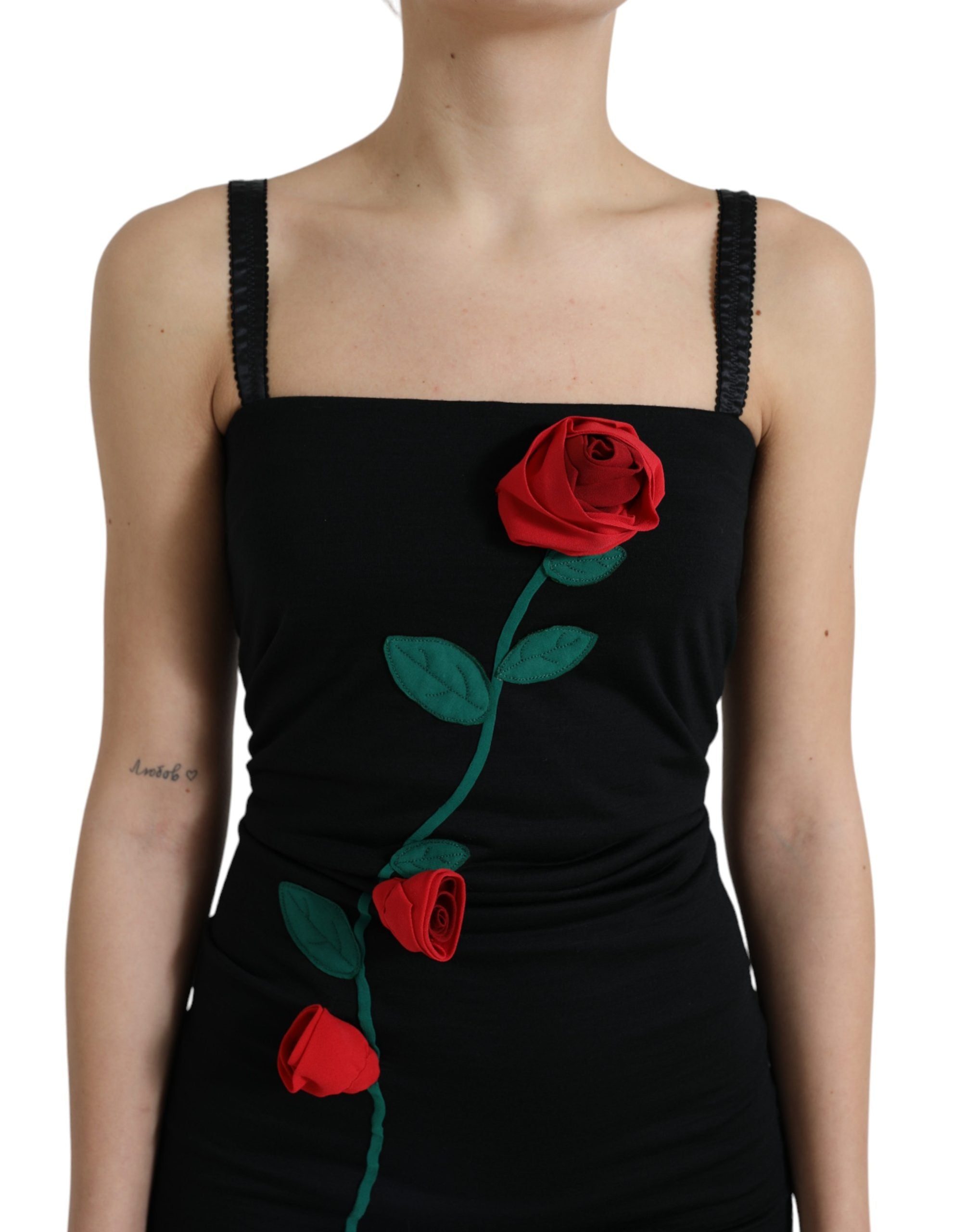 Robe sans manches en laine noire Dolce & Gabbana avec appliqués de roses, élégante et sophistiquée.