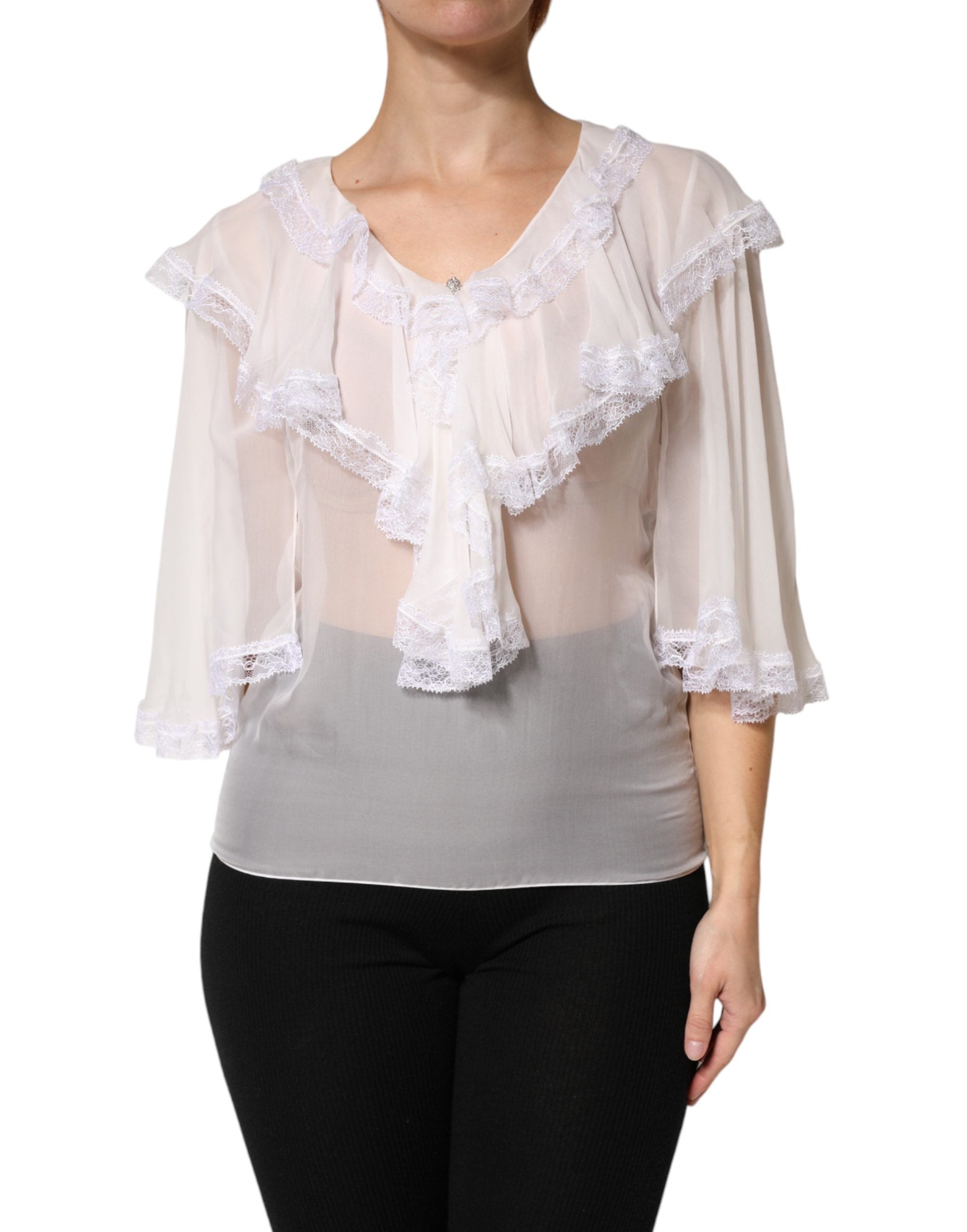 Blouse blanche Dolce & Gabbana à manches longues avec dentelle, volants et détails élégants, vue de face.