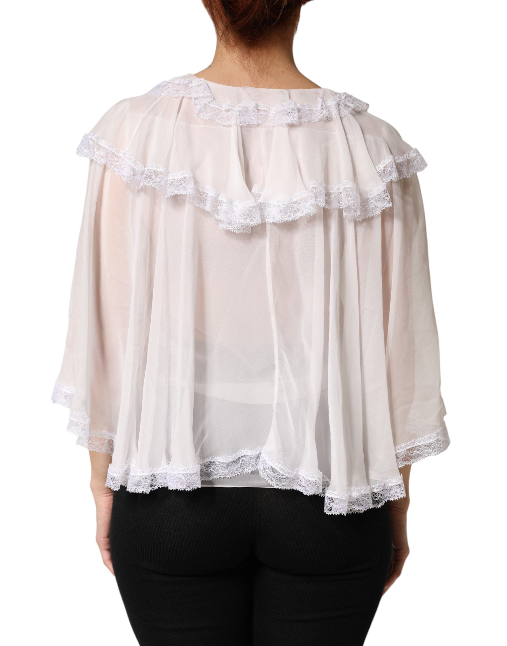 Chemise blanche Dolce & Gabbana en dentelle avec manches longues, volants et détails élégants pour un style sophistiqué.
