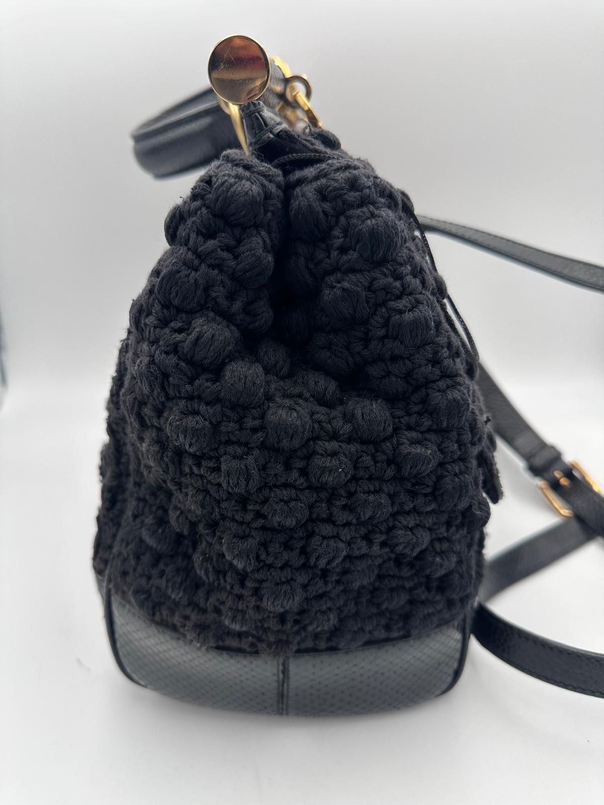 Sac à main Dolce & Gabbana Sicily en python et macramé, design élégant avec motifs sophistiqués et détails artisanaux.