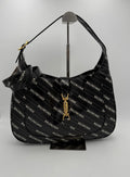 Sac à main Gucci Jackie 1961 en cuir avec logo en métal doré et bandoulière, élégant et classique.