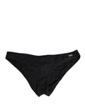 Sous-vêtements Dolce & Gabbana en nylon noir avec logo DG, design régulier et plaque emblématique visible sur l'image.