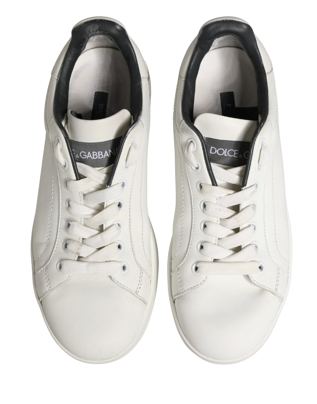 Chaussures sneakers en cuir blanc et noir Dolce & Gabbana Portofino, style élégant et moderne, vues de face.