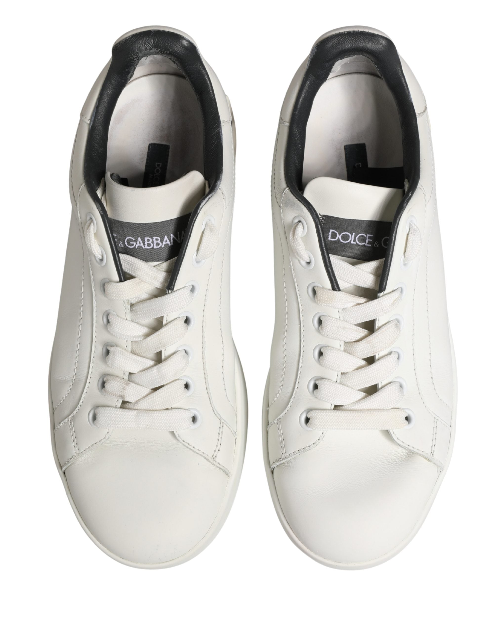 Chaussures sneakers en cuir blanc et noir Dolce & Gabbana Portofino, style élégant et moderne, vues de face.